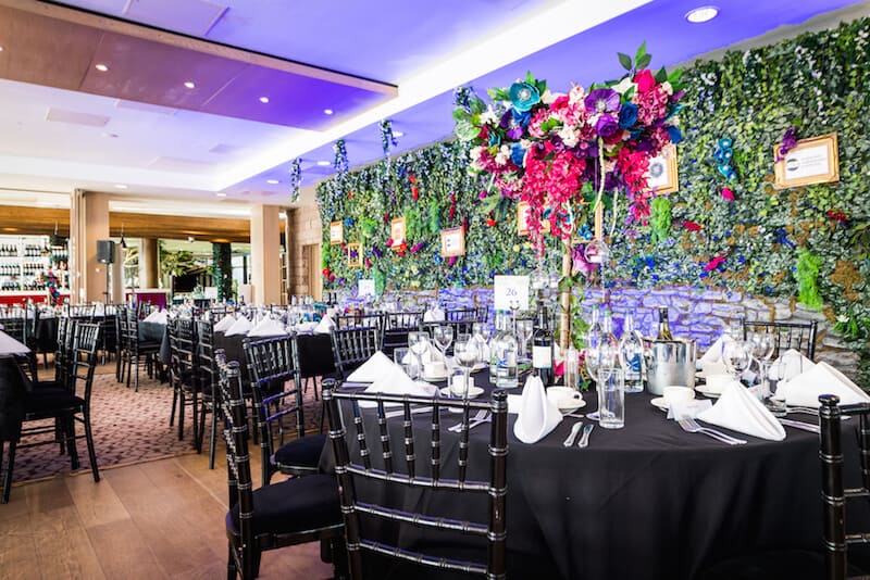 Great British Garden Party foliage wall brick centre pieces flower colral gala dinner awards ceremony