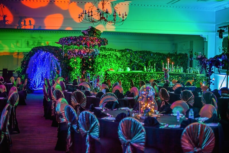 tunnel entrance to venue gala dinner foliage table centres foliage wall foliage bar