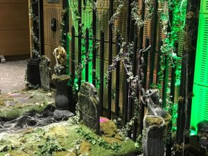 Halloween themed event props with gravestones and skeletons fences and green up lighting street lamp