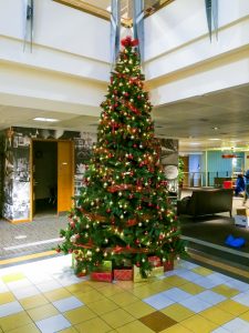 Traditional Christmas Tree in reception lobby with red and gold decorations