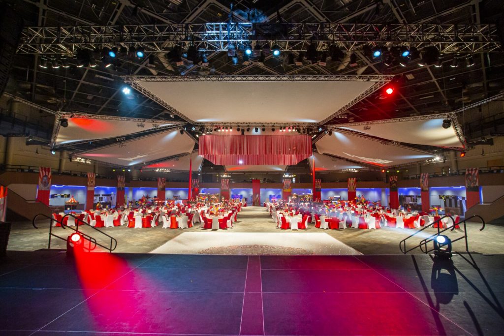 circus theming and red and white chairs and ceiling draping