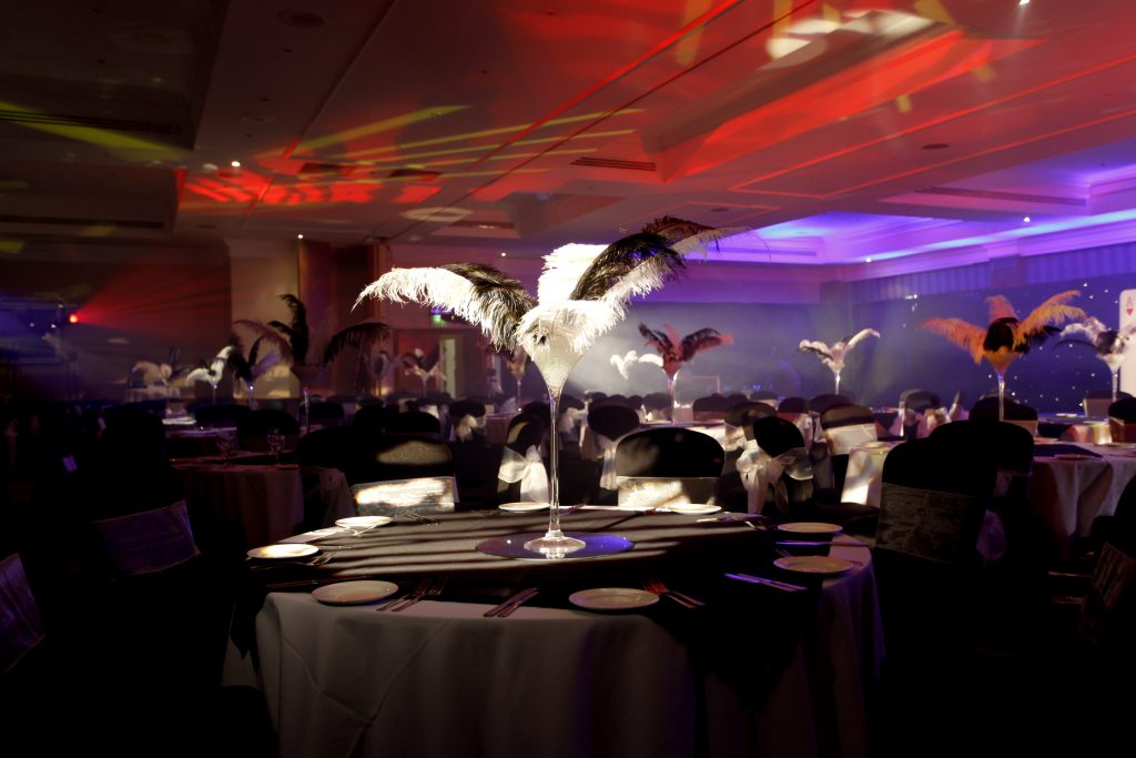 james bond themed black and white feathered table centres