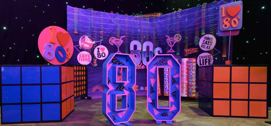 retro throwback 80's numbers giant rubrics cubes colourful backdrop