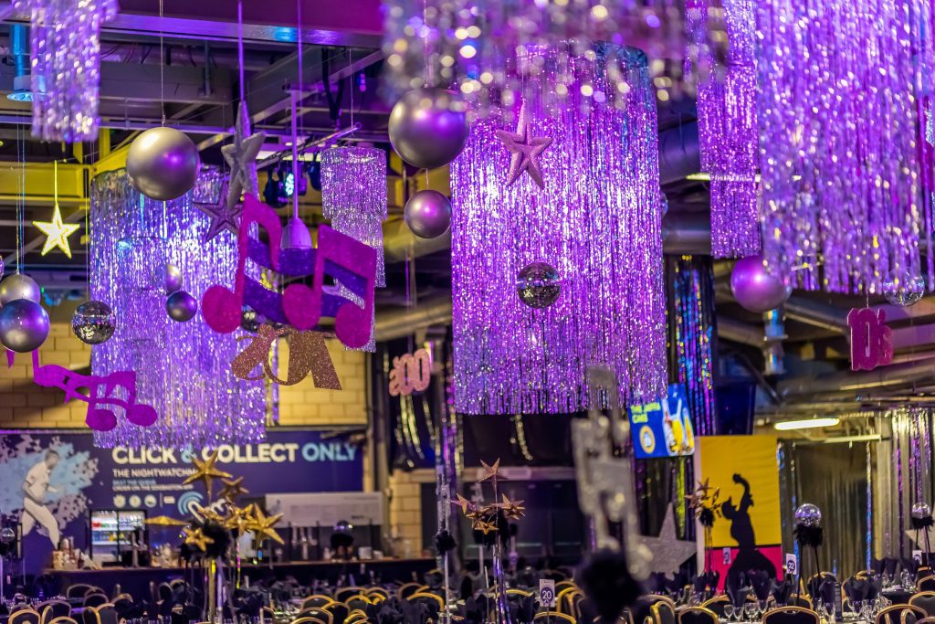Eventologists 70s Disco Themed Event Silver Muscial Note Ceiling Dressing Hire
