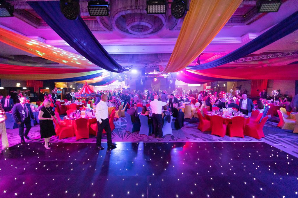 Eventologists Circus Themed Event Black Sparkle Dancefloor Colourful Ceiling Dressing Hire