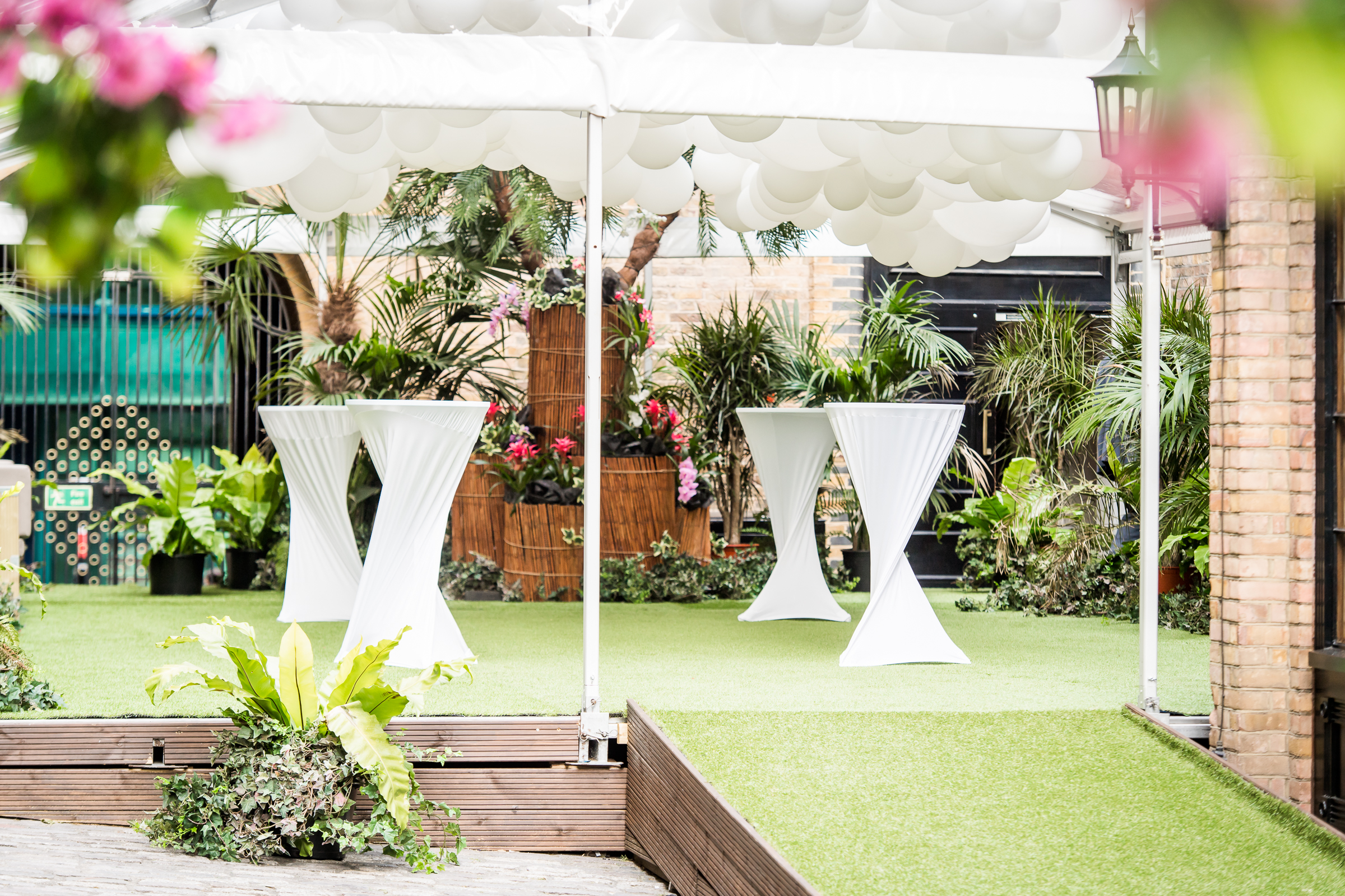 Eventologists Ibiza Themed Event White Poseur Table Foliage Backdrop Tropical Hire