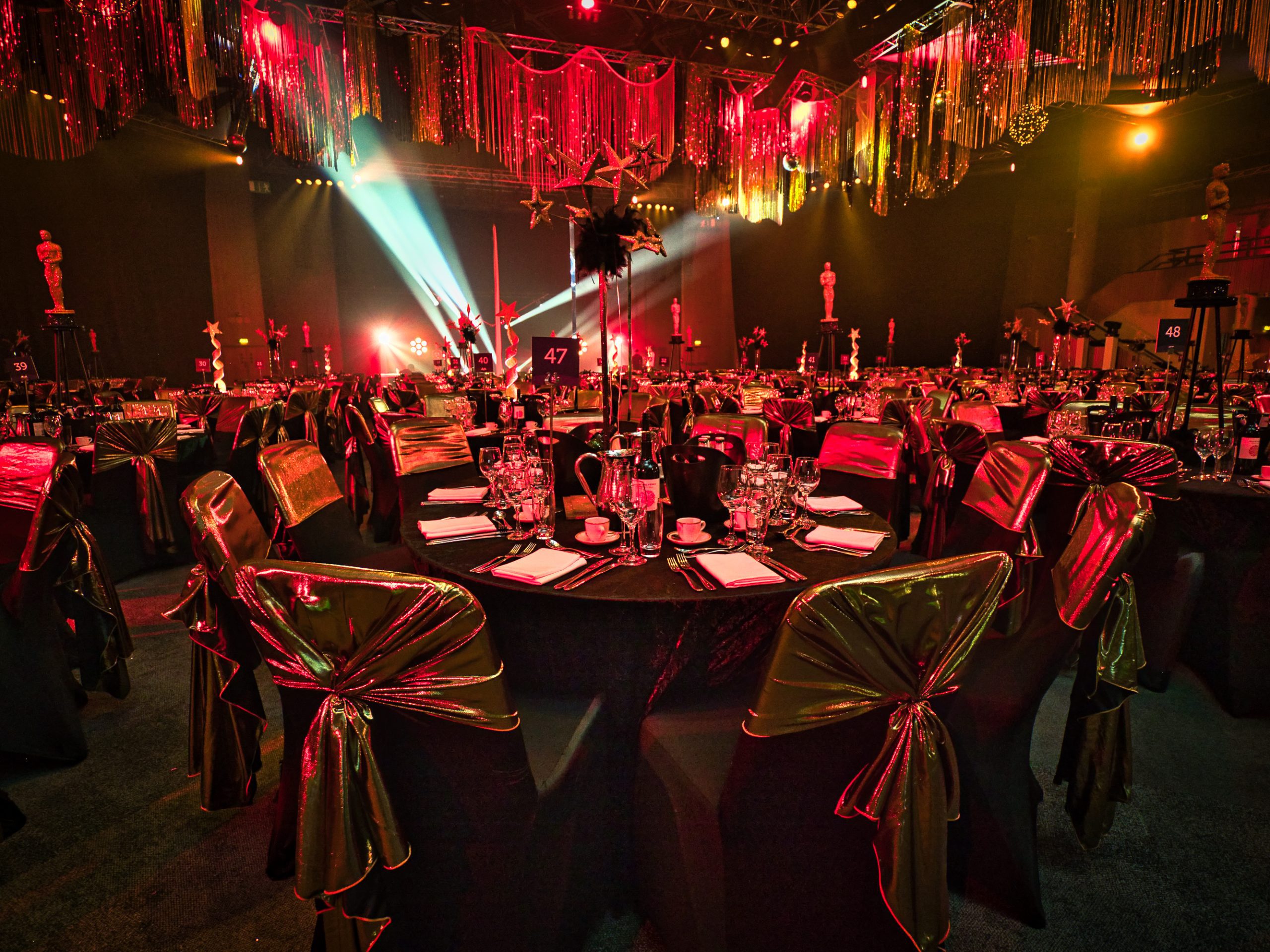 Eventologists James Bond 007 Themed Event Black Gold Chair Cover Sashes Table Centre Prop Hire