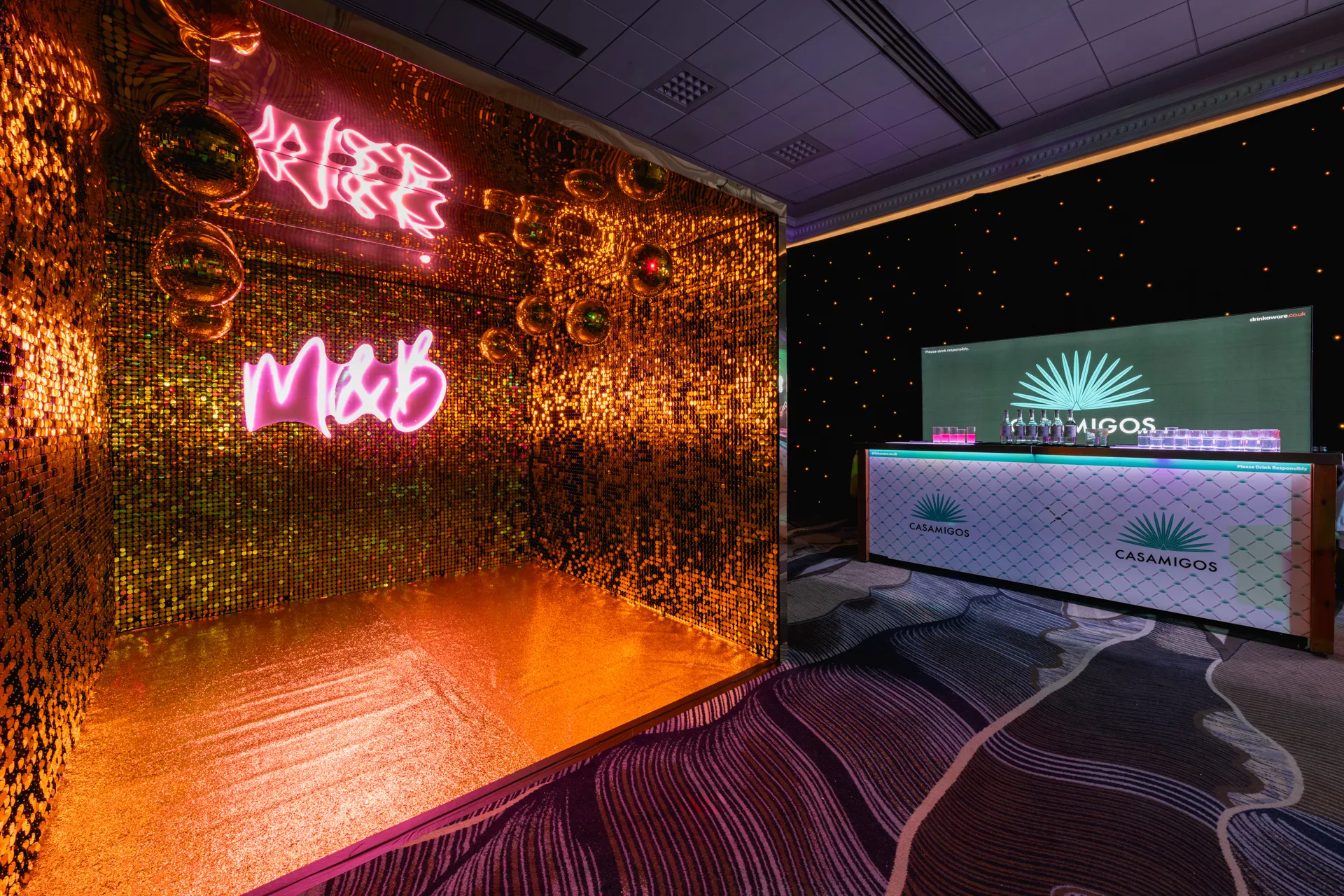 Gold Sequin Photo Nook Beside Branded Spirits Bar