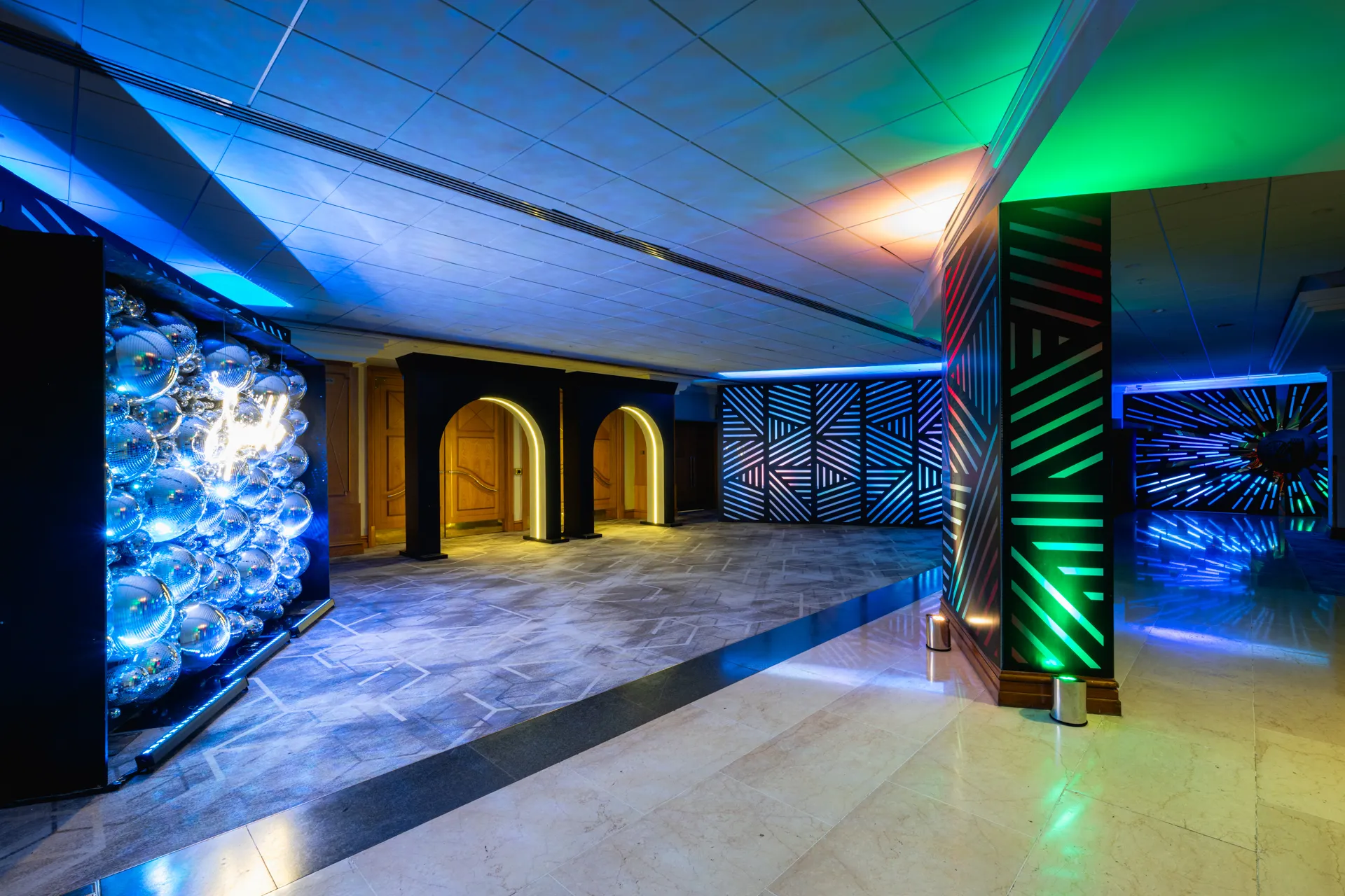 Mirror Ball Wall & Geometric Light Panels in Lobby