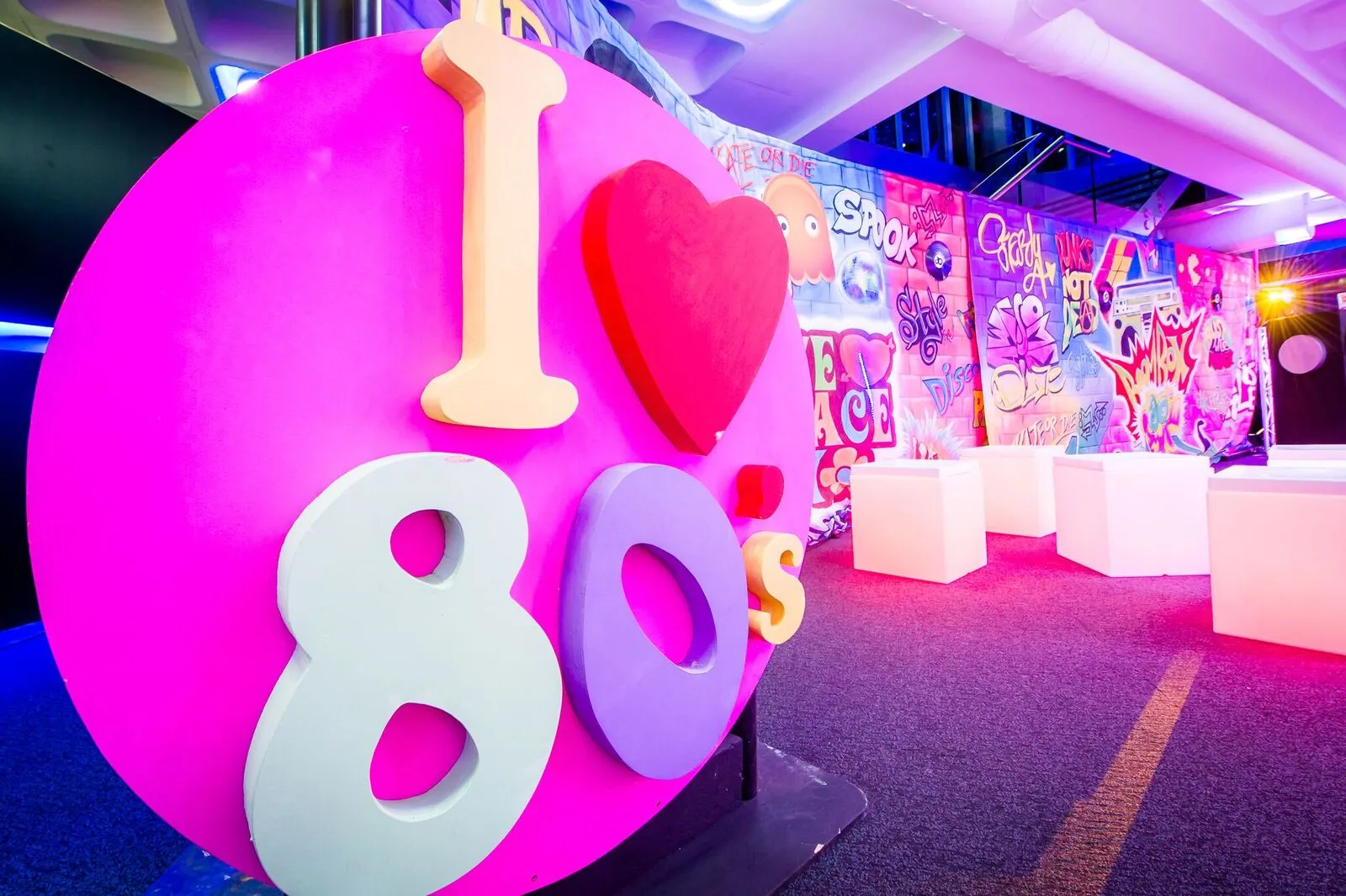 I Love 80s' Sign Beside Graffiti Backdrop