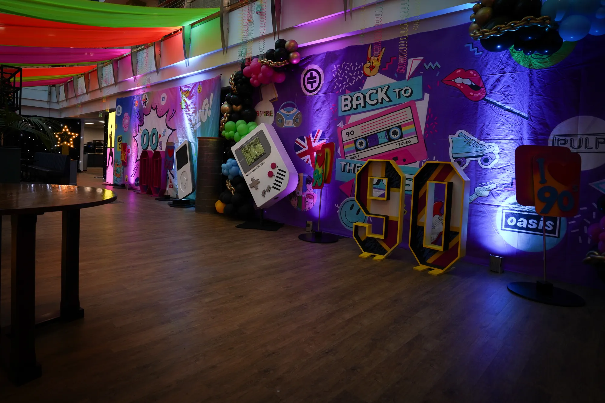 90s Corridor with Giant Game Boy & Balloon Garland