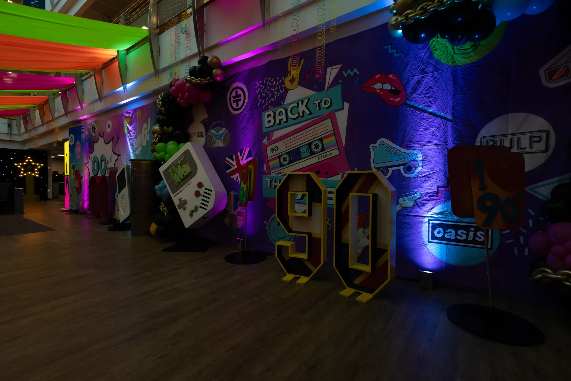 Back To The 90s' Sign with Giant Game Boy & Oasis Prop