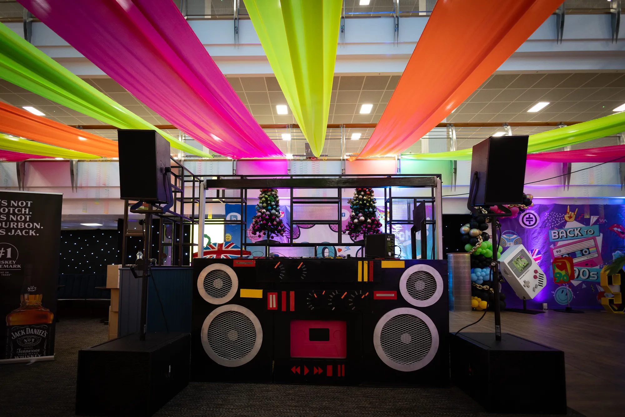 Boombox DJ Booth Under Neon Fabric Ceiling