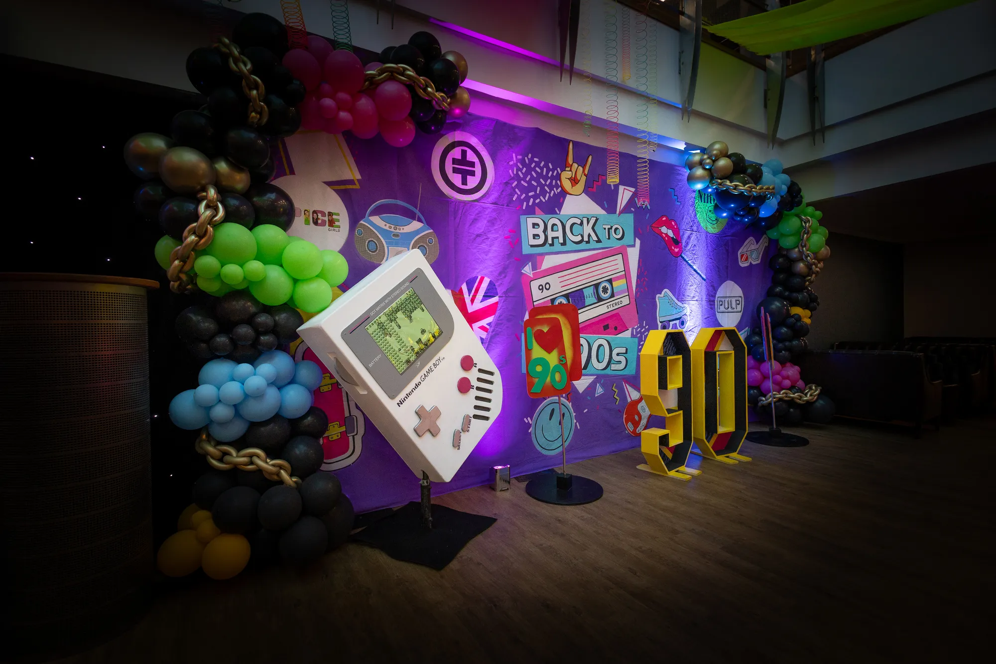 Giant Game Boy Prop Framed by Balloon Garland Arch