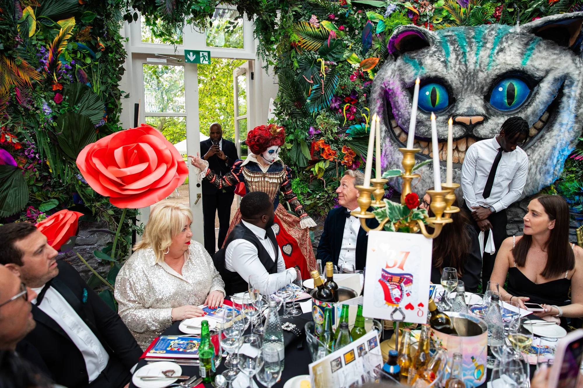 Immersive Dining Under Giant Roses & Cheshire Cat