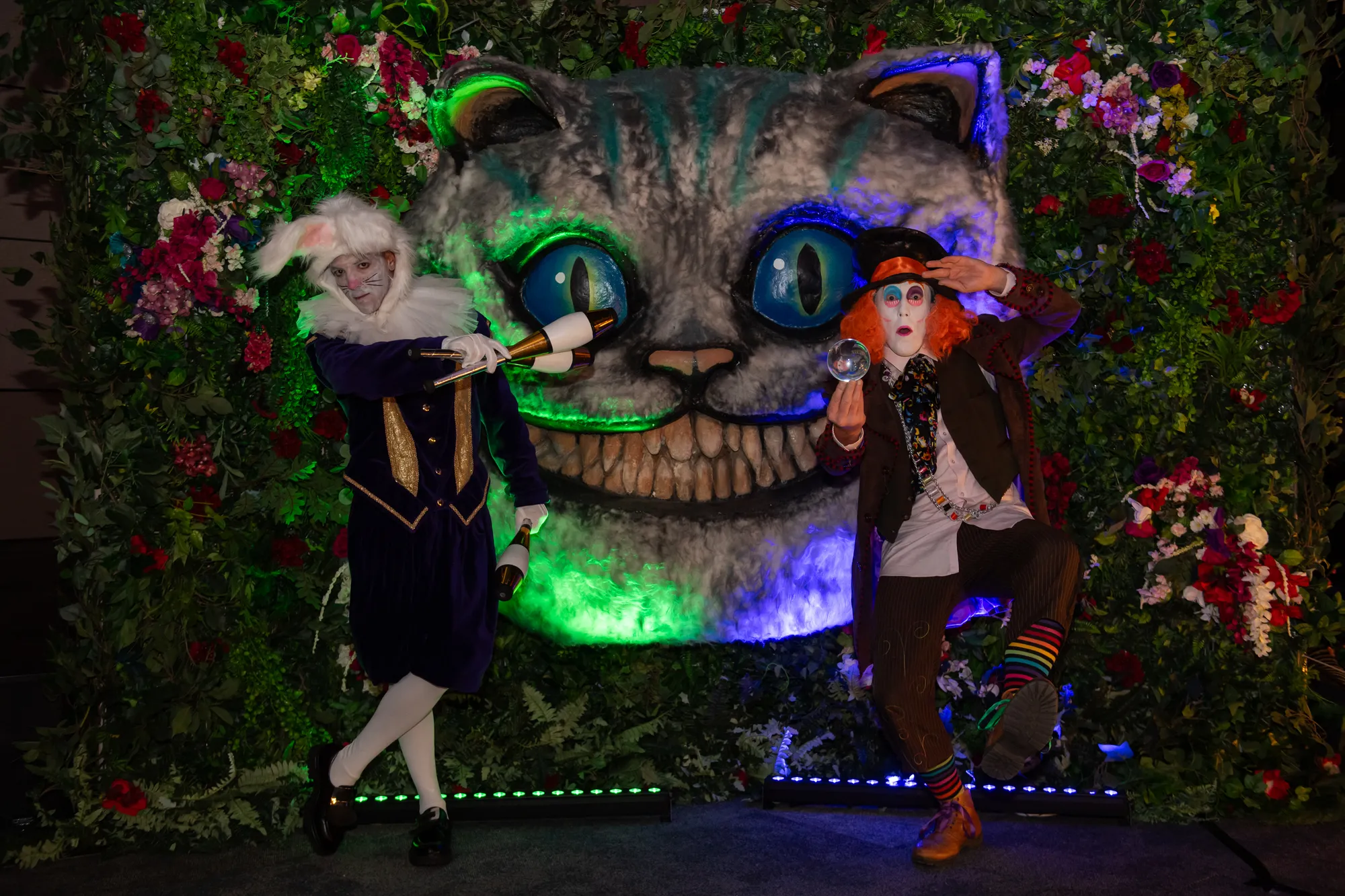 White Rabbit & Mad Hatter Performers at the Cheshire Cat Wall"
