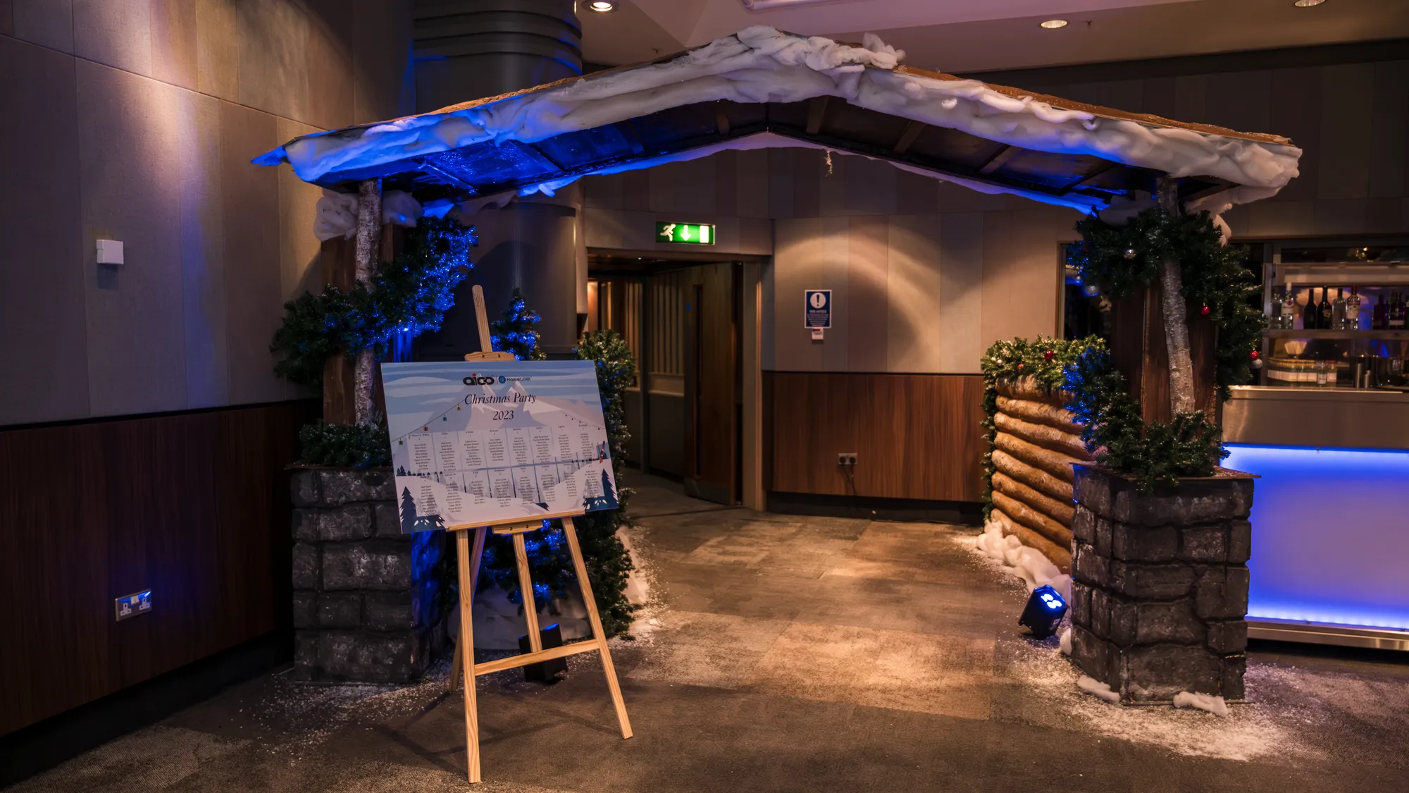 Snow-Roofed Chalet Entrance with Table Plan