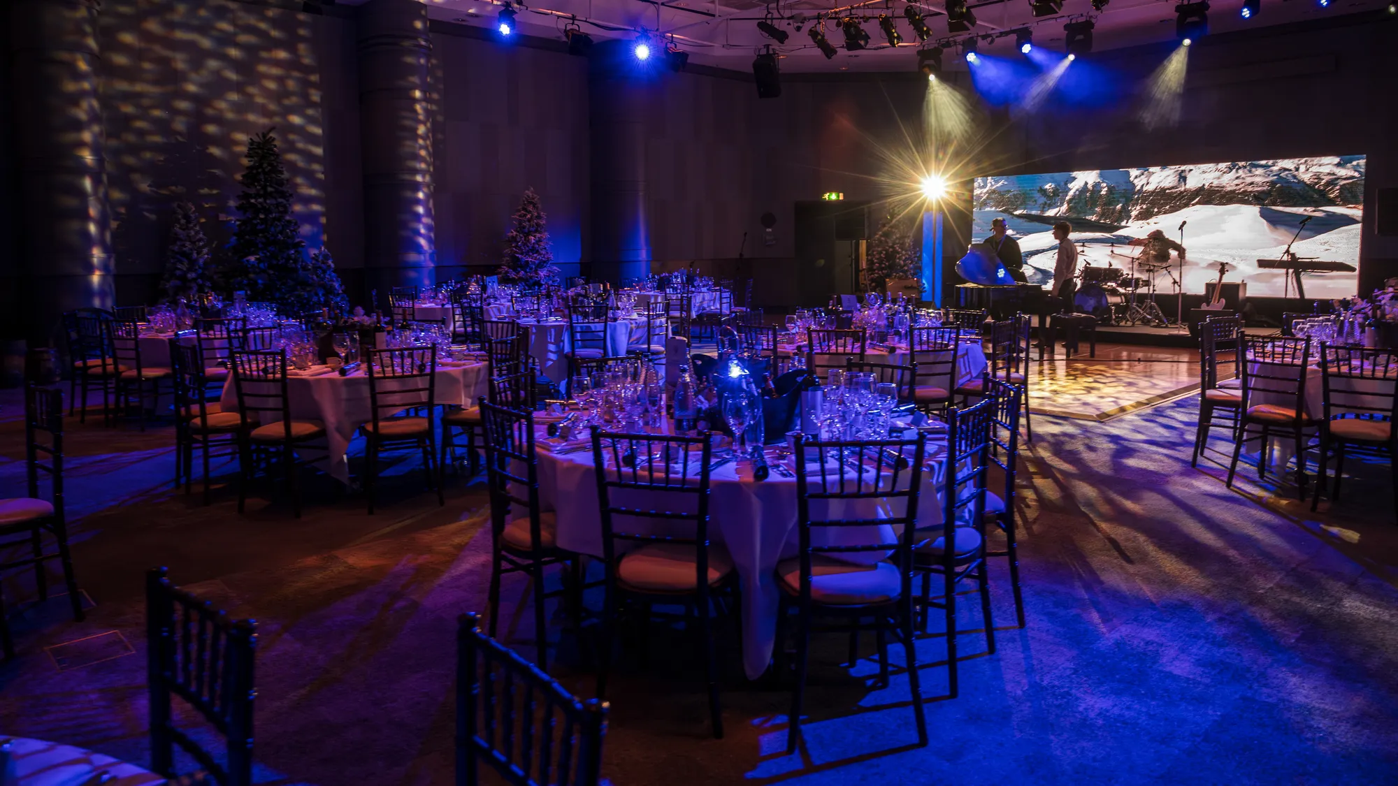 Winter Banquet Dinner Beneath a Giant Mountain Screen