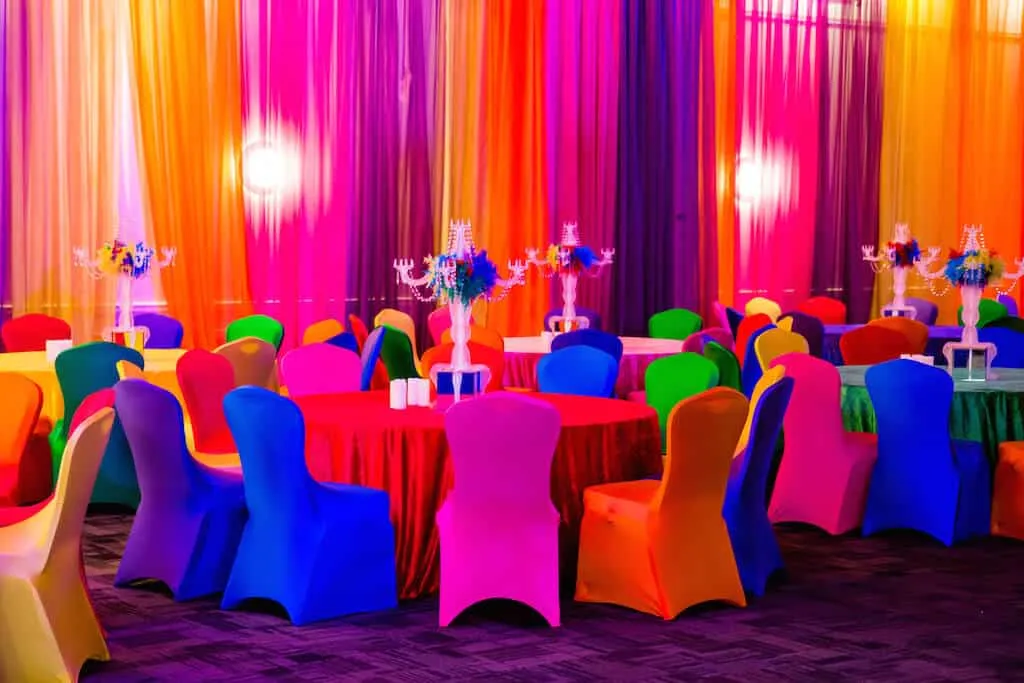 Rainbow Chair Covers Beneath Striped Drape Backdrop