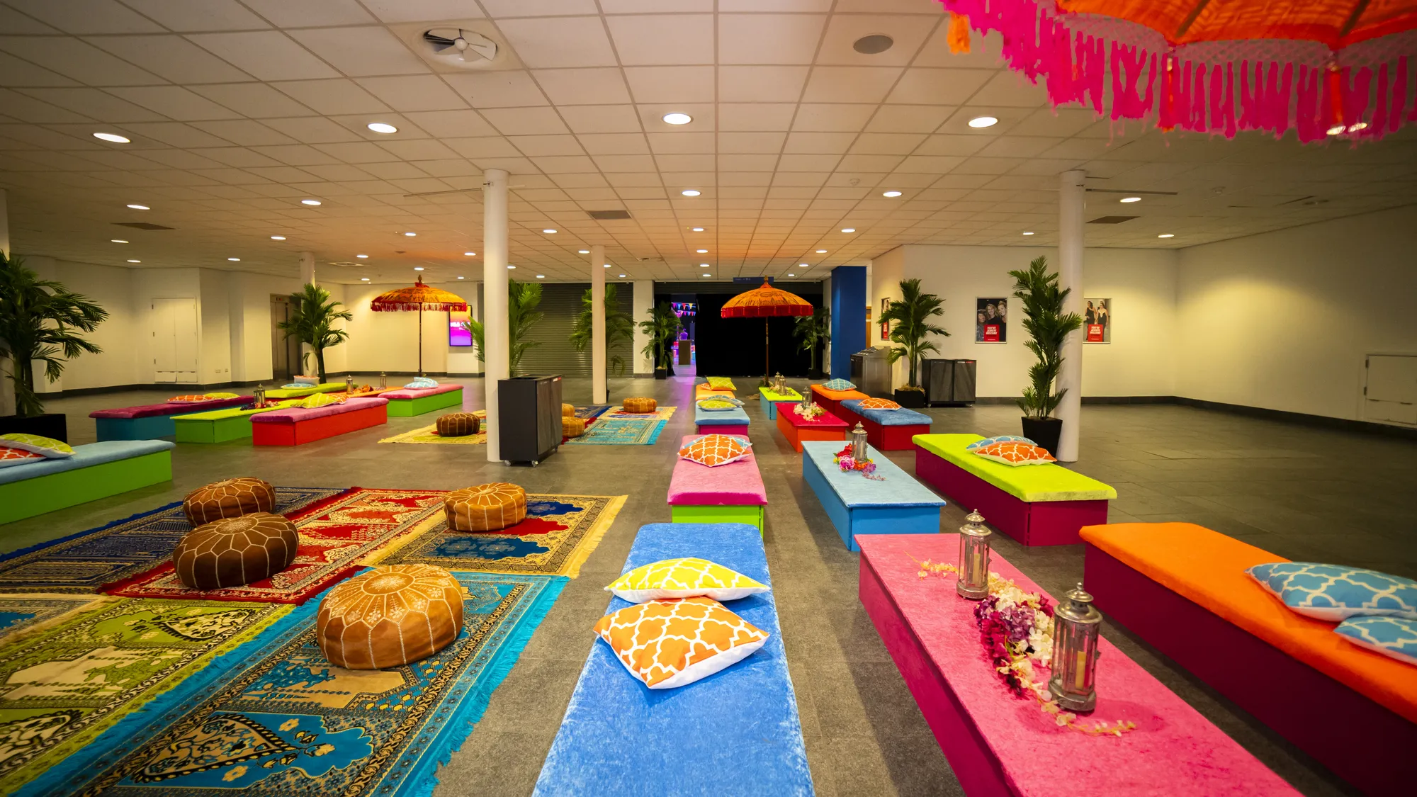 Foyer Lounge with Moroccan Pouffes & Patterned Rugs